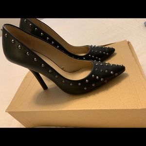 Studded black point toe heels